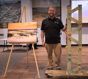 Jeff Wenzel with a section of the iconic swing bridge
